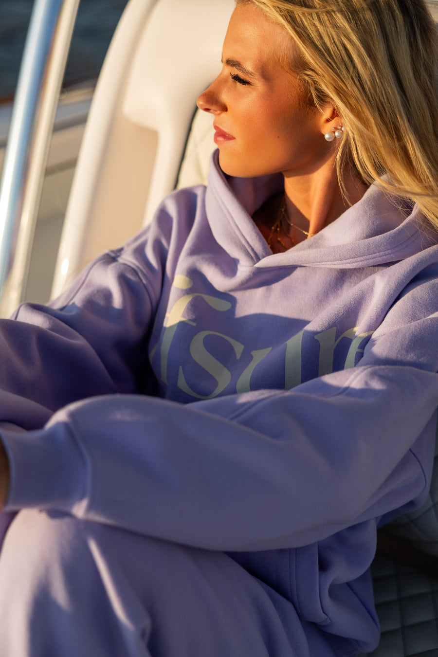 Offsure hoodie in Light Purple, golden hour on a boat