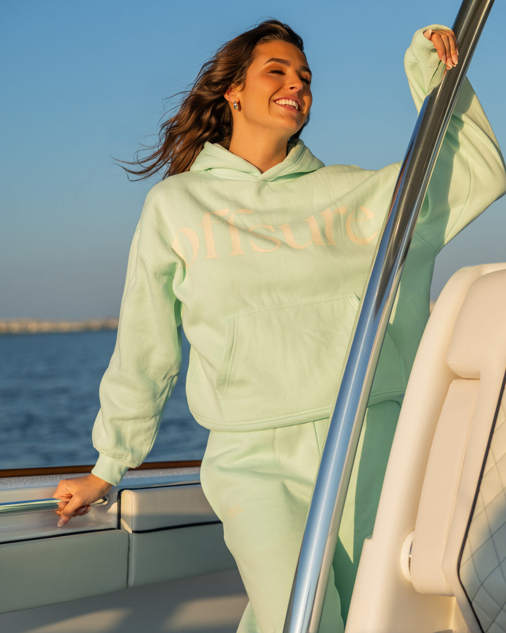 Offsure Print Pullover and Wide-Leg Pant in Sea Glass, standing on the boat deck